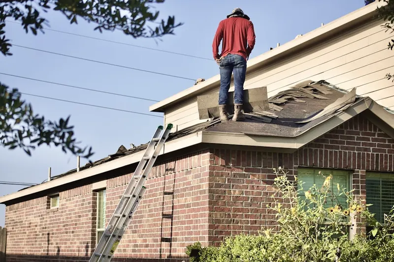 Professional roofer working on a residential roof in Fernandina Beach